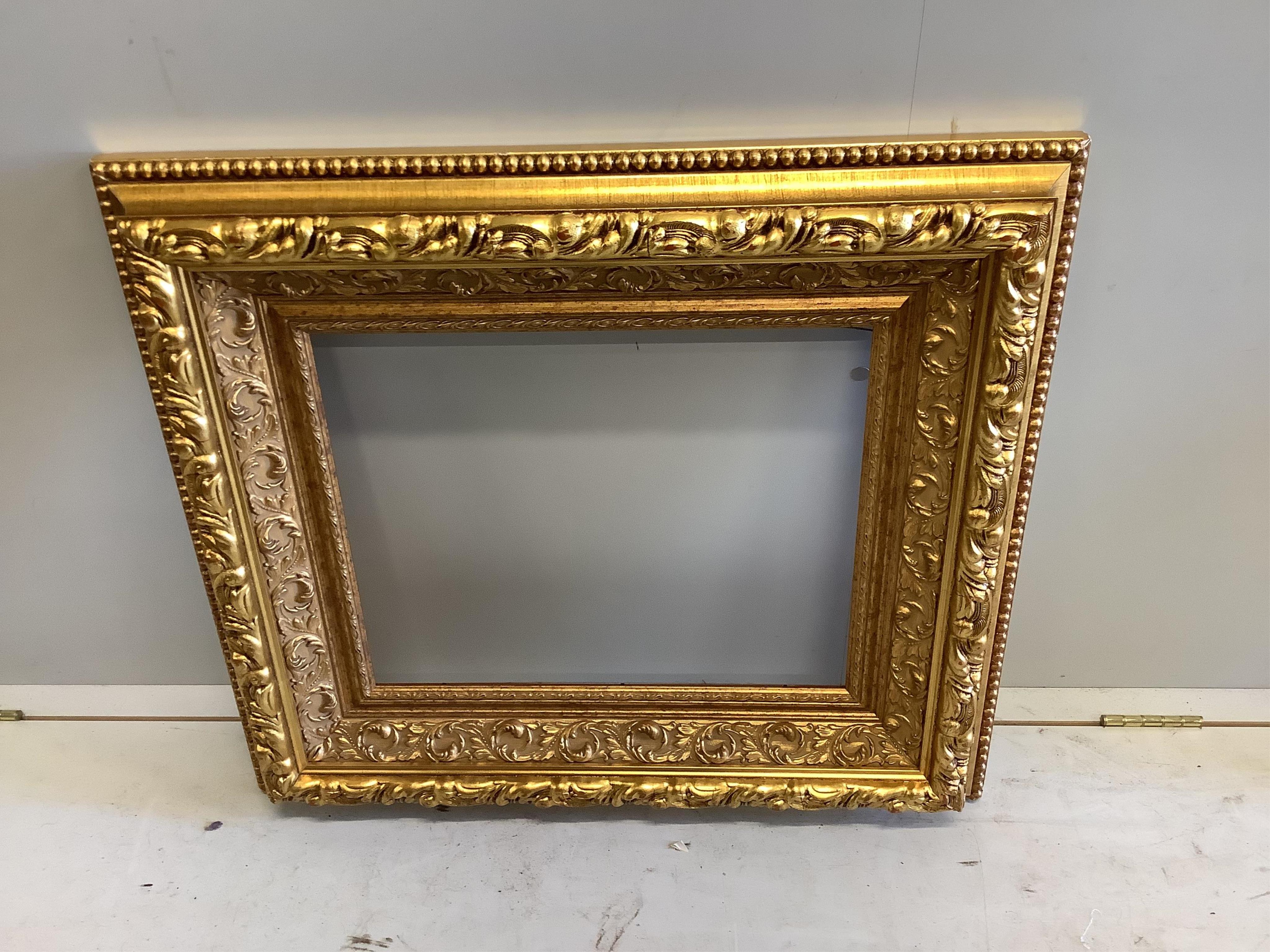 Two Victorian style rectangular gilt frames, larger width 69cm, height 78cm. Condition - fair to good